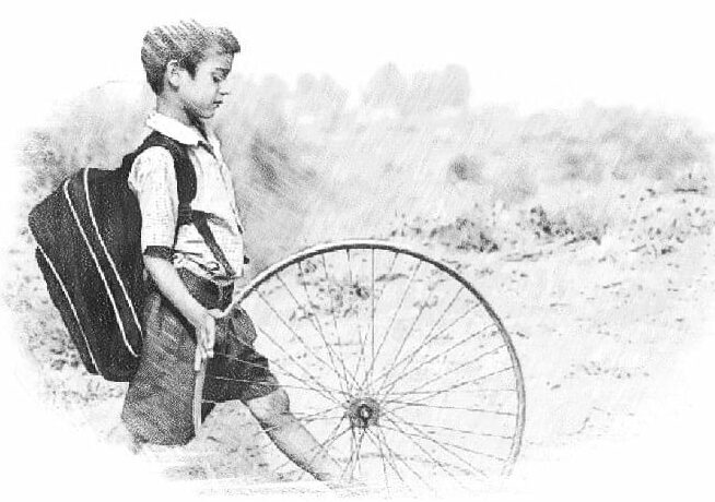 Boy playing with a tire