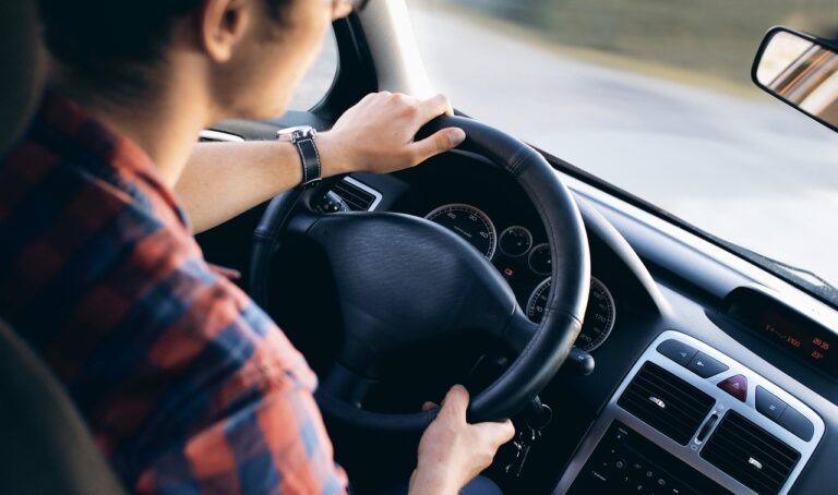 man driving car